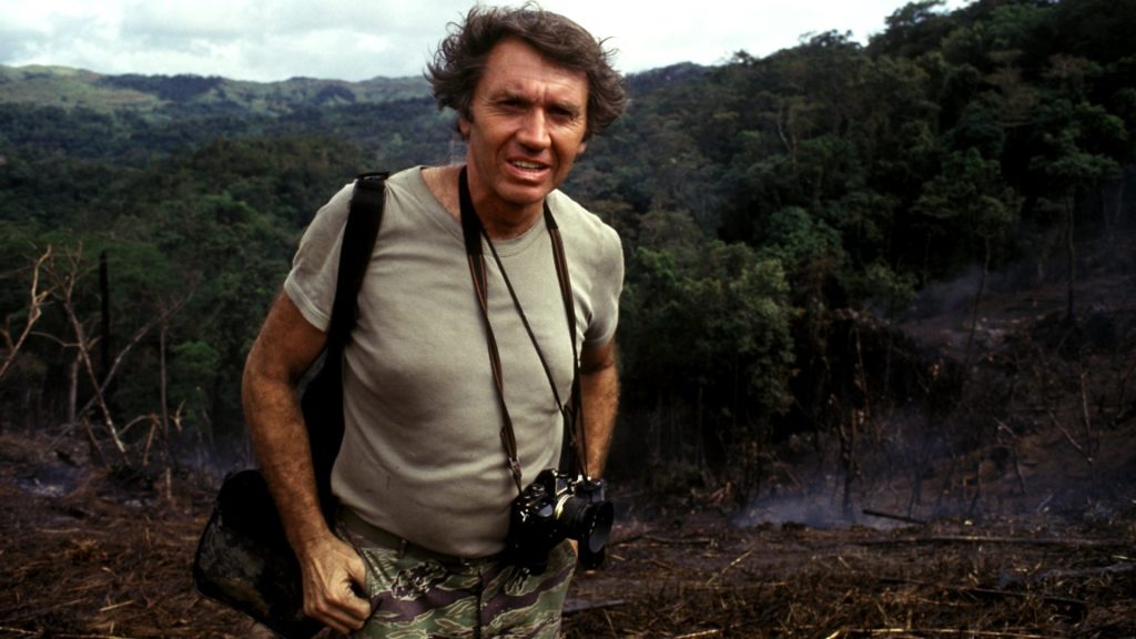 Sir Don McCullin with his OM camera