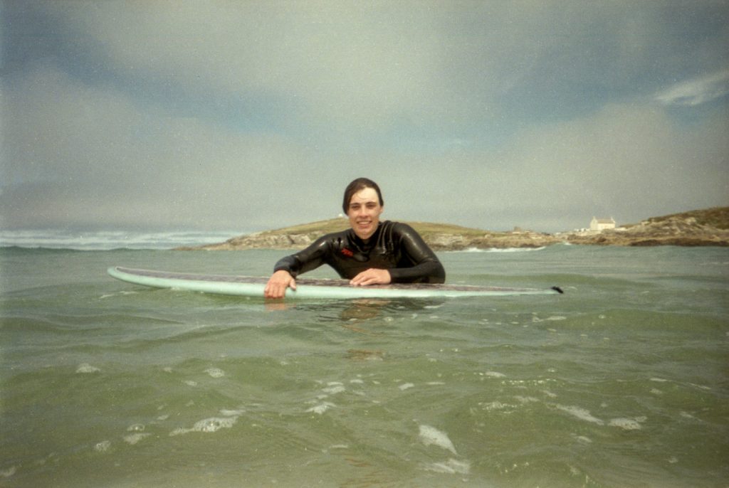 Portrait of a surfer photographed from the water with a waterproof disposable camera