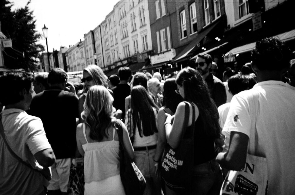 Black and white street photograph at Portobello Road in Notting Hill, photographed with an Olympus XA3